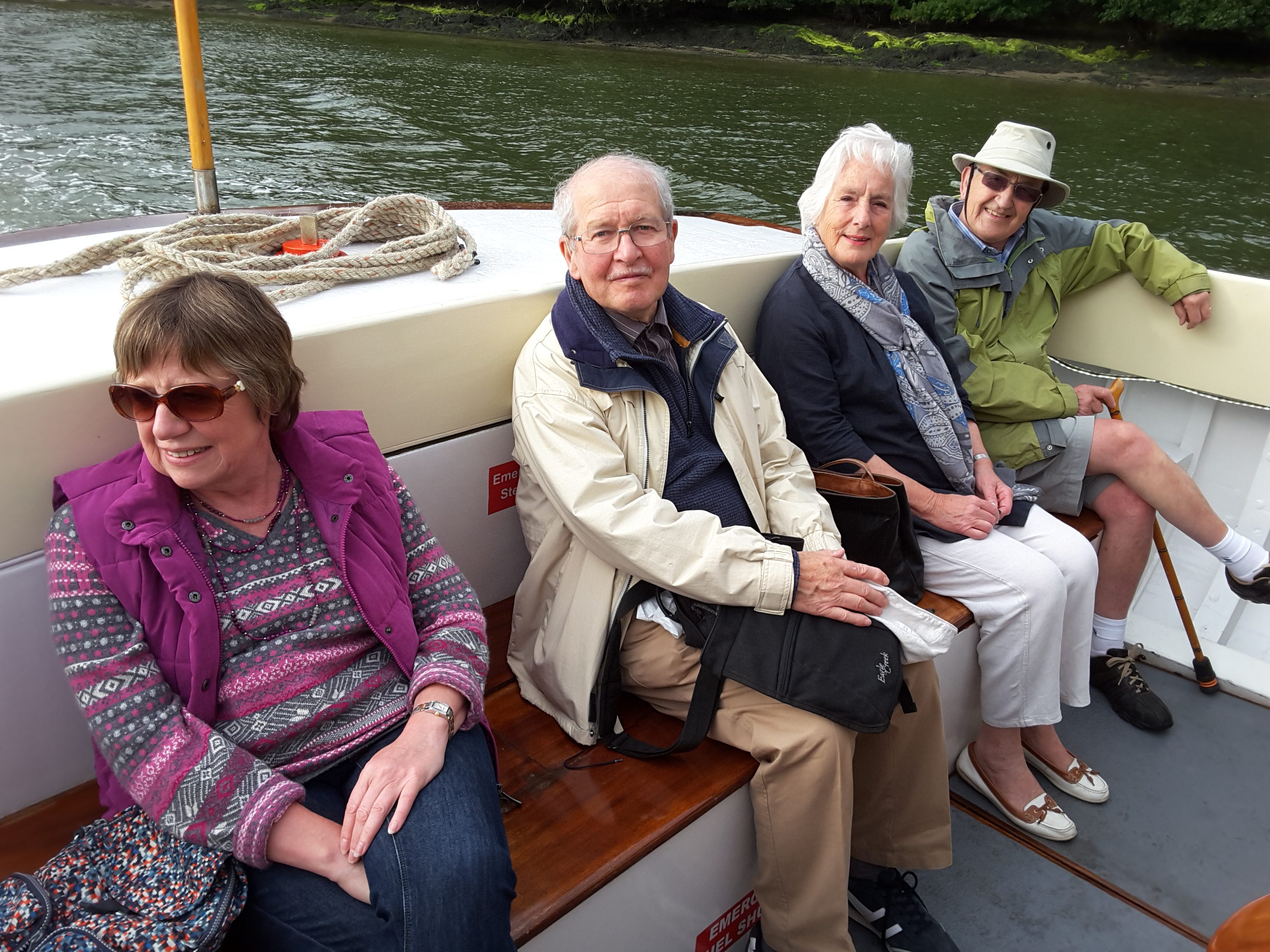 Friends enjoying a calm journey on the River Fal.